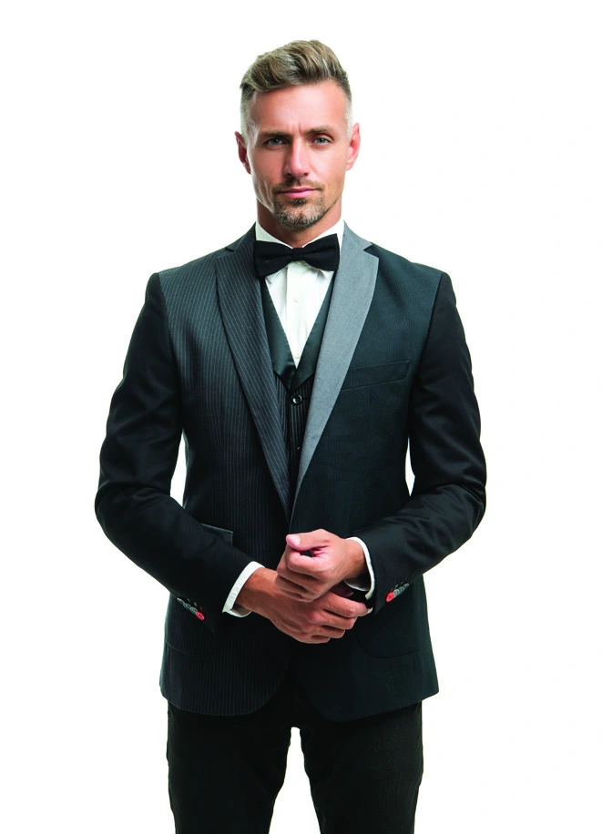 A classic black dinner suit with a white shirt and bow tie